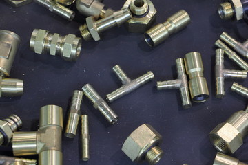 A many new tube fittings on blie background, car fuel system furniture