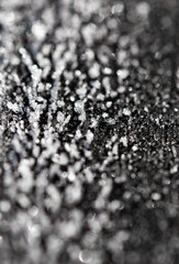 transparent ice crystals on a dark background
