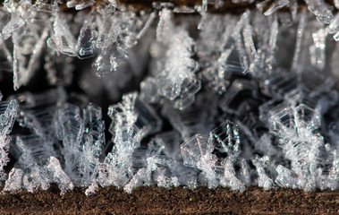 transparent ice crystals on a dark background