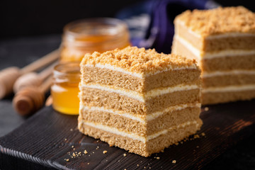 Delicious Layer Honey Cake On Black Serving Board. Closeup View. Russian Cake Medovik