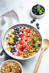 Breakfast fruit granola yogurt bowl. Superfood breakfast. Vegetarian Smoothie