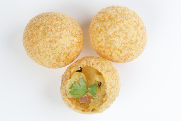 Tadeonal subcontinental street snack food chickpeas potato pani puri fuska with tamarind sauce © oqba
