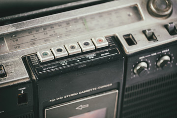 Close-up playback control buttons on audio cassette player.- Old radio receiver. retro technology 1980s. 