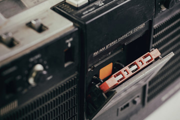 Selective focus vintage cassette player - Old radio receiver. retro technology 1980s. 