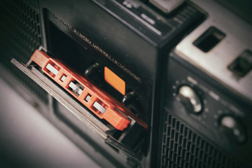Obraz premium Selective focus vintage cassette player - Old radio receiver. retro technology 1980s. 