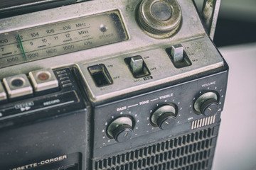 Obraz premium Close-up playback control buttons on audio cassette player.- Old radio receiver. retro technology 1980s. 