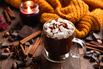 Mug Of Hot Chocolate With Cinnamon and Marshmallows On Old Wooden Table. Comfort Food