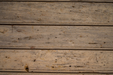 Texture of rustic and old wooden boards, with cuts and stains. Close up