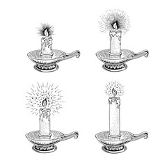 Hand drawn candle set. Burning candle in an old candlestick engraved in retro style. Vector illustration