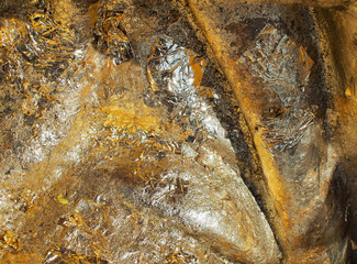 Shiny gold foil paper on the rock wall texture background (gold, texture, golden)