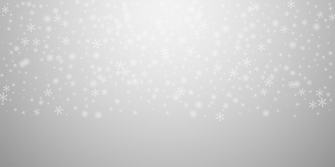Sparse glowing snow Christmas background. Subtle f