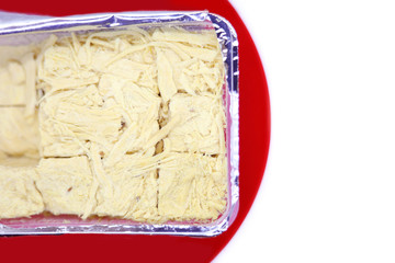 Traditional Indian Sohan papdi on red plate