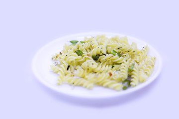 plate of pasta with copy space on white background, top view