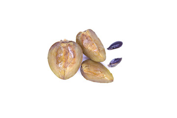 Sapota fruit cut into pieces and seeds in white background