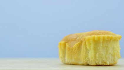Delicious soft bread on a wooden background. Single