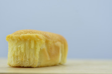 Delicious soft bread on a wooden table. One