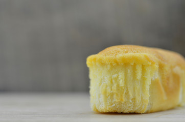 Delicious soft bread on a wooden table. One