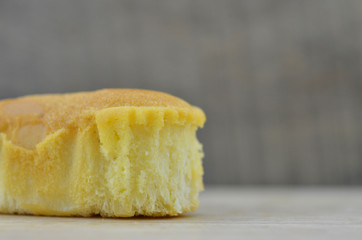 Delicious soft bread on a wooden background. One