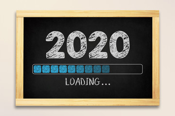 Loading New Year 2020 Concept on Chalkboard