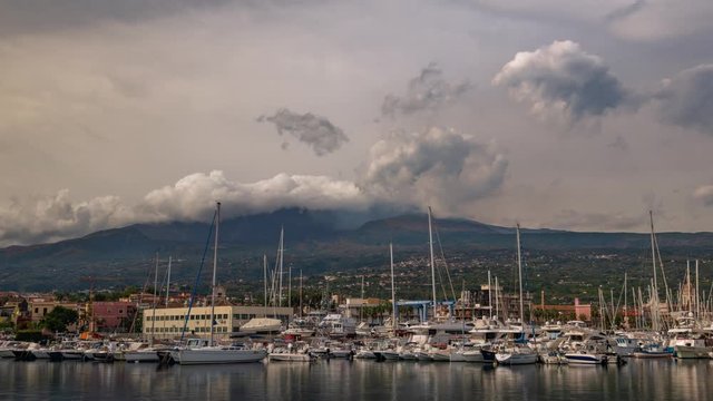 Timelapse view of the marina of Riposto, in the East coast of Sicily with mount Etna in the background