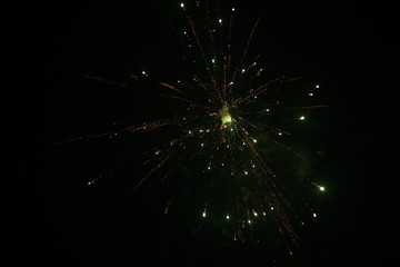Fototapeta na wymiar Beautiful fire crackers or fireworks in the sky. celebrating new year and Christmas and Diwali