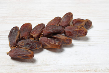 Dried dates on a branch.