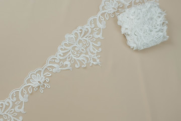Texture lace fabric. lace on white background studio. thin fabric made of yarn or thread. a...