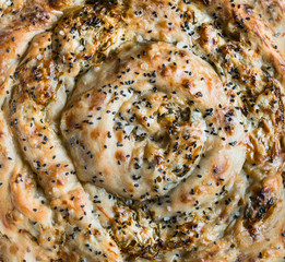 Close up of savory pie with Phyllo dough. Su boregi, burek or borek. Top view. Turkish cuisine.