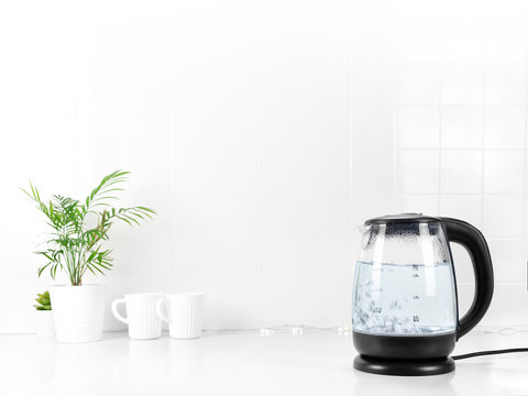 Glass Transparent Kettle On White Kitchen Table