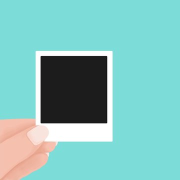 hand holding blank retro paper photo frame. instant photo frame polaroid concept. Vector flat cartoon illustration for web sites and banners design.