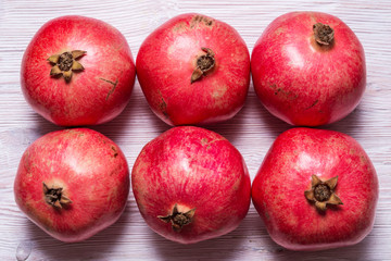 Group of red garnets on wooden background