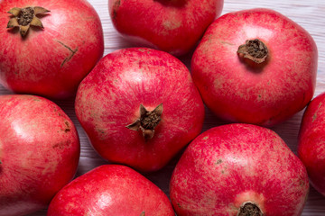 Group of red garnets on wooden background