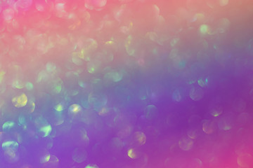 Abstract colorful bright sparkling background, defocused christmas lights. Blurred background for holidays and parties in trendy colors.