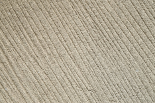 Processed sandstone with parallel lines closeup