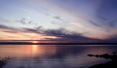 Fototapeta na wymiar Clouds and the Setting Sun over Lake Roxen, Sweden