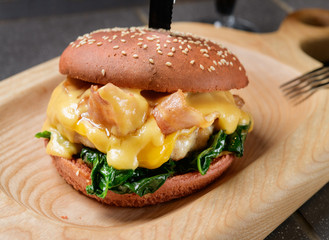 juicy burger on a wooden board