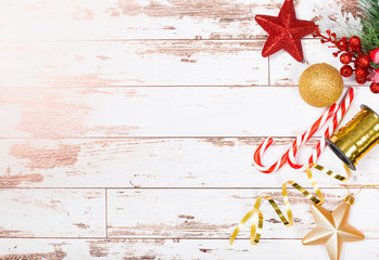 Christmas holidays art composition on white wooden background with Christmas tree decoration and copy space for your text.