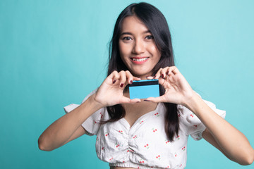 Young Asian woman smile with  blank card