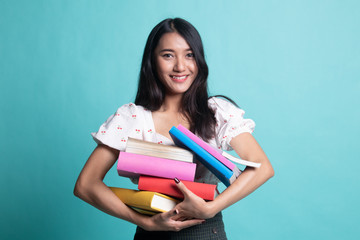 Young Asian woman studying  with may books