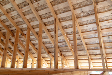 Wooden roof at a cottage construction site