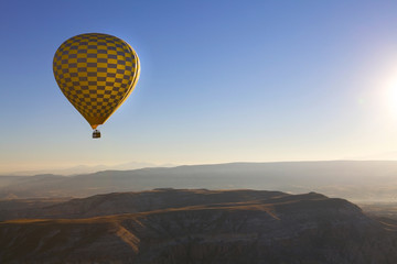 Hot air balloon flight in autumn in Cappadocia national Park. Valley of love. Meet the dawn.