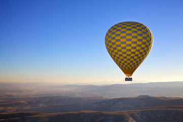 Fototapeta premium Hot air balloon flight in autumn in Cappadocia national Park. Valley of love. Meet the dawn.