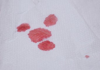 Blood red in white tissue  background