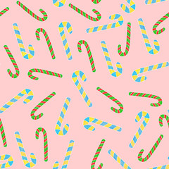 Candy canes seanless pattern on pink background. Textile and paper design.