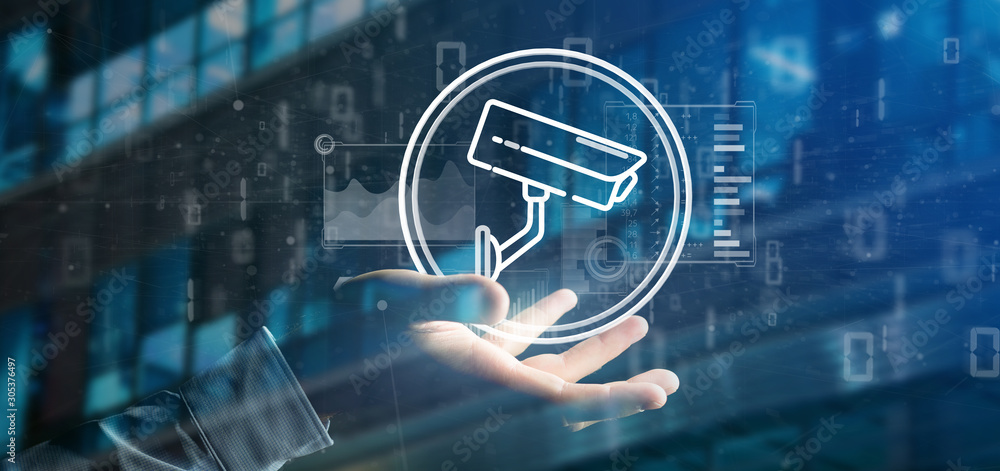 Poster businessman holding security camera system icon and statistics data - 3d rendering