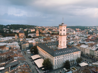 Fototapeta na wymiar aerial view of lviv bell clock tower on sunset overcast sky