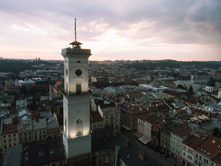 Obraz premium aerial view of lviv bell clock tower on sunset overcast sky