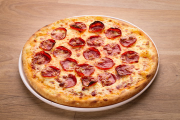 tasty delicious pizza food on a wooden background
