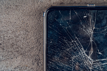 Mobile smartphone with broken screen close up