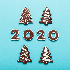 New Year and Christmas chocolate gingerbread cookies in silhouette of 2020. Homemade delicious bakery, sweet family time and traditions.